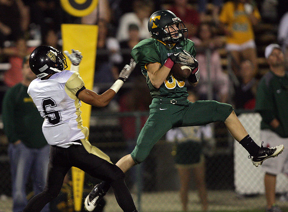 Tracy's Tyler Mendoes (86) and Chavez's Rodel Igarta (6)